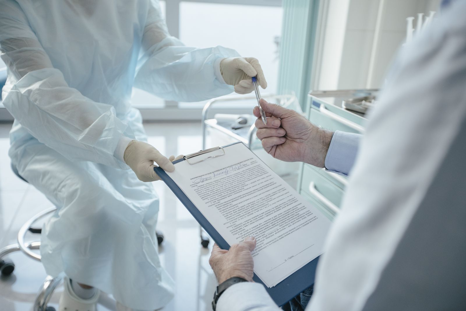 Medicare forms and a pen on a desk